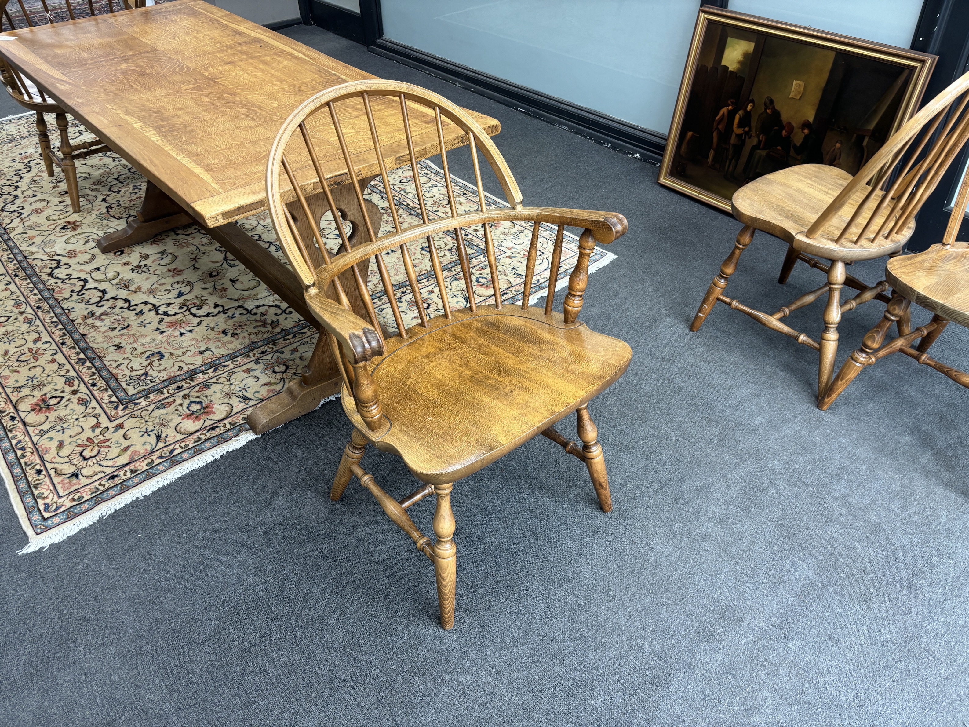 A set of six reproduction Windsor beech comb back dining chairs, two with arms